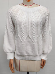 White cable-knit round-neck sweater displayed on a mannequin