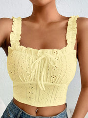 Black eyelet tie-front tank top on a model