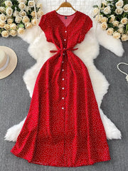 Red polka-dot button-front dress laid flat