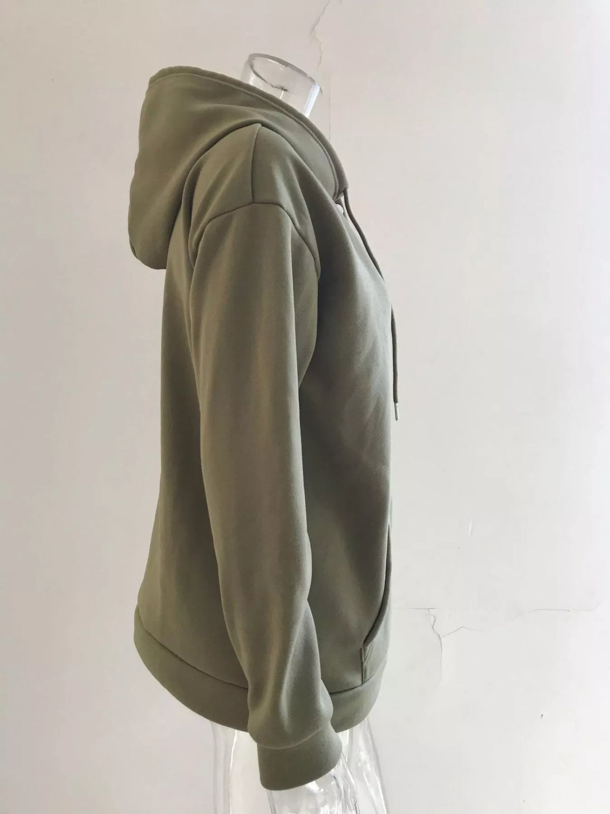 Women’s plus-size kangaroo-pocket drawstring hoodie in olive-green side view on hanger