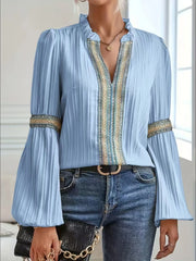 Notched textured balloon-sleeve blouse in blue front view