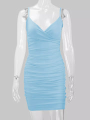 Light blue spaghetti-strap ruched mini dress displayed from the front on a mannequin.