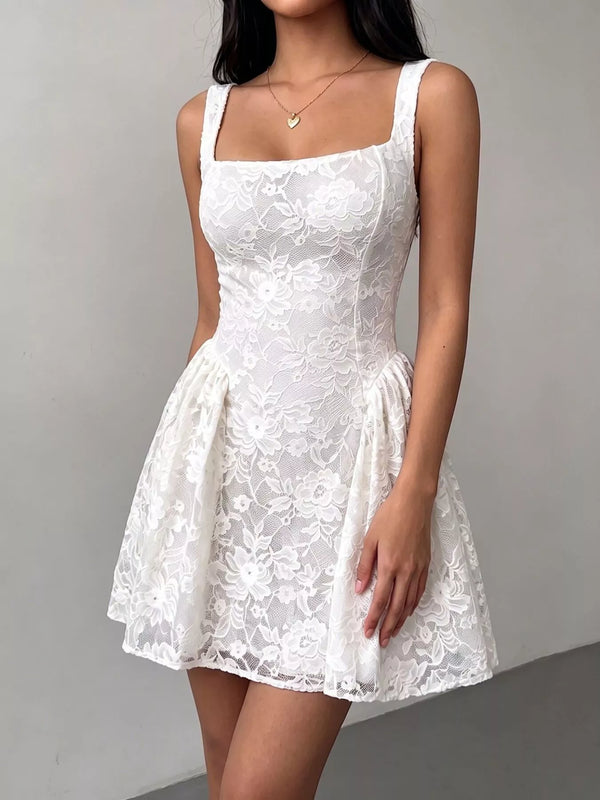 Angled front view of the white square-neck floral lace dress and flared mini skirt.