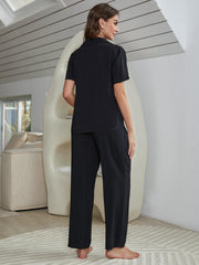 Black lounge set with short-sleeve shirt and straight-leg pants, side view
