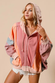 Color-block hoodie in mint, pink, and orange with a front zipper and hood.
