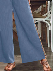 Close view of blue side stripe and pant hem