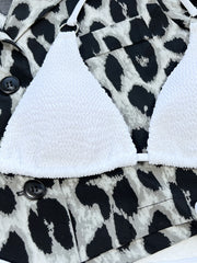 White bikini bottoms and halter top laid flat