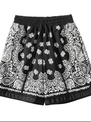 Black floral and paisley drawstring shorts, front view
