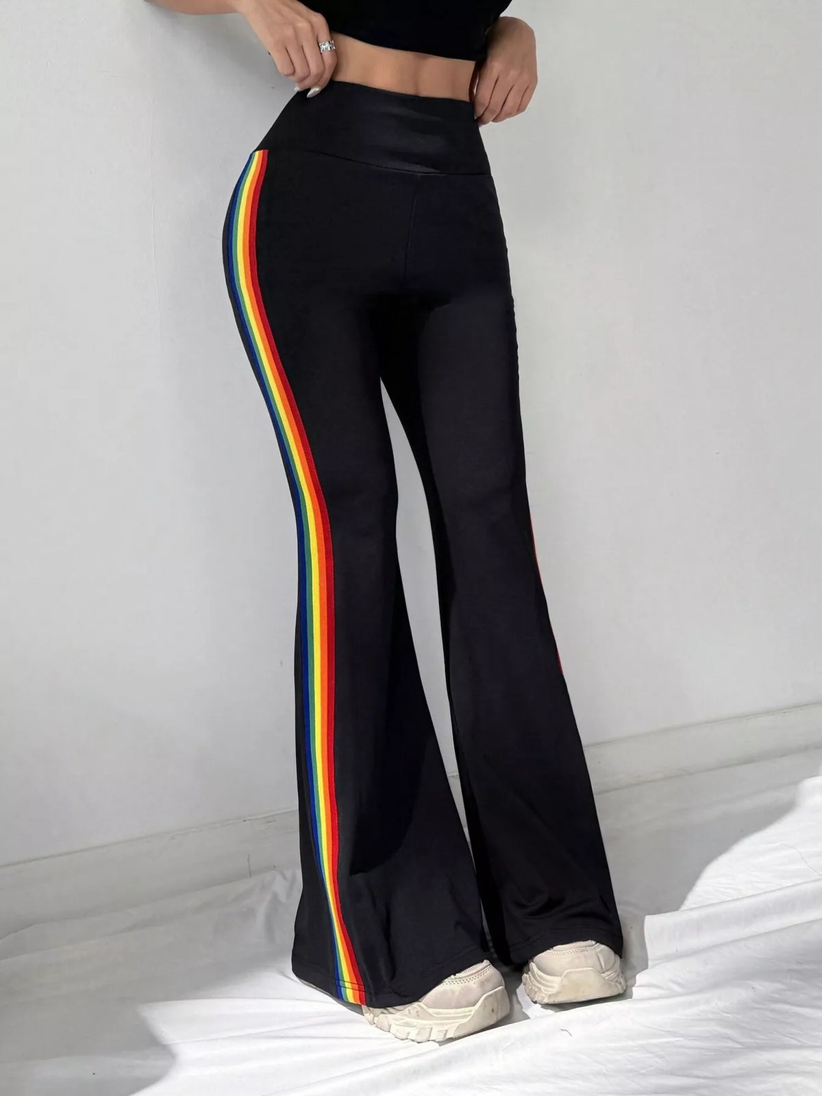 Black active pants showing high waistband and stripe detail