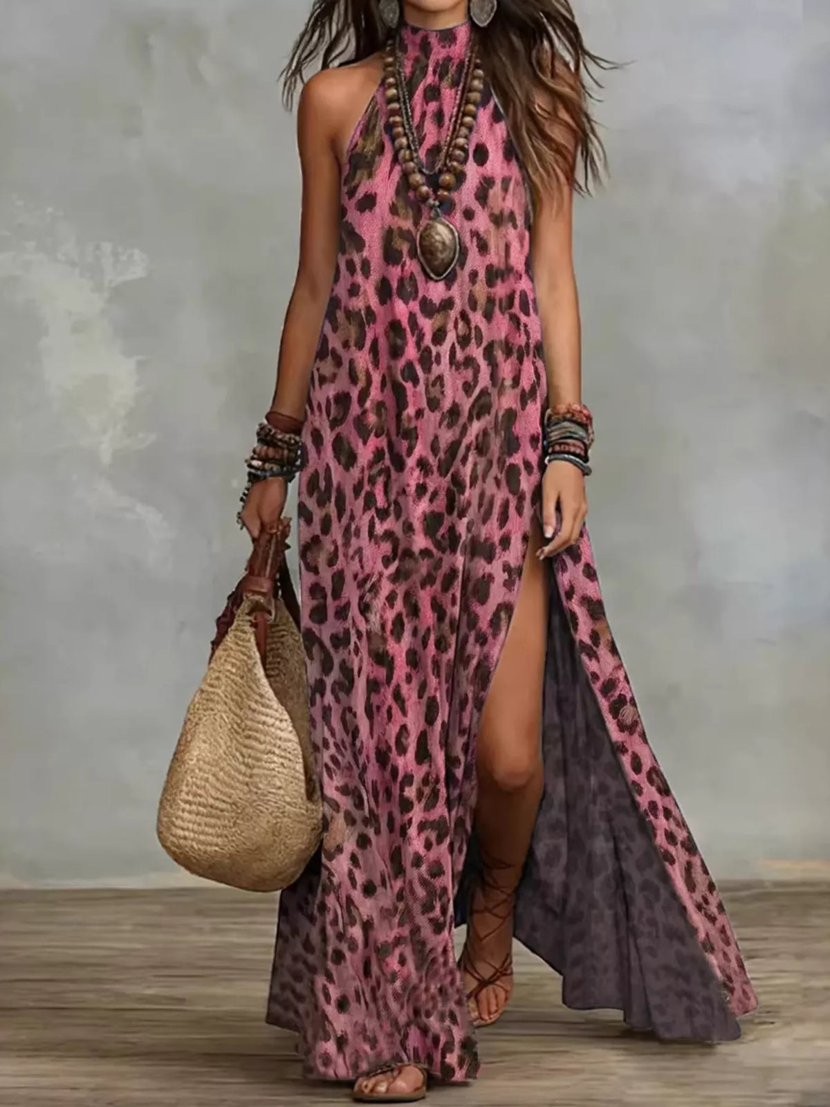 Pink leopard-print halter maxi dress with a high side slit, full-length front view.