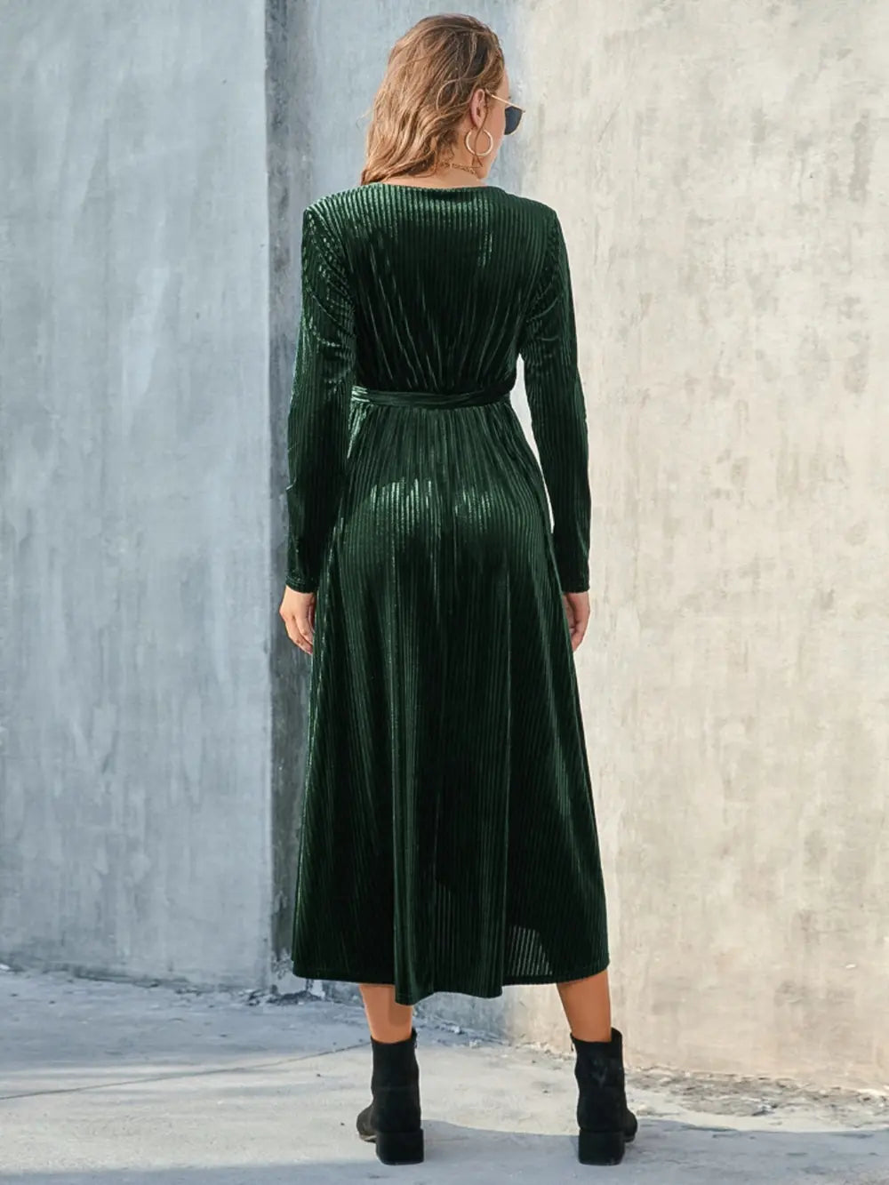 Back view of dark green long-sleeve dress with tied waist
