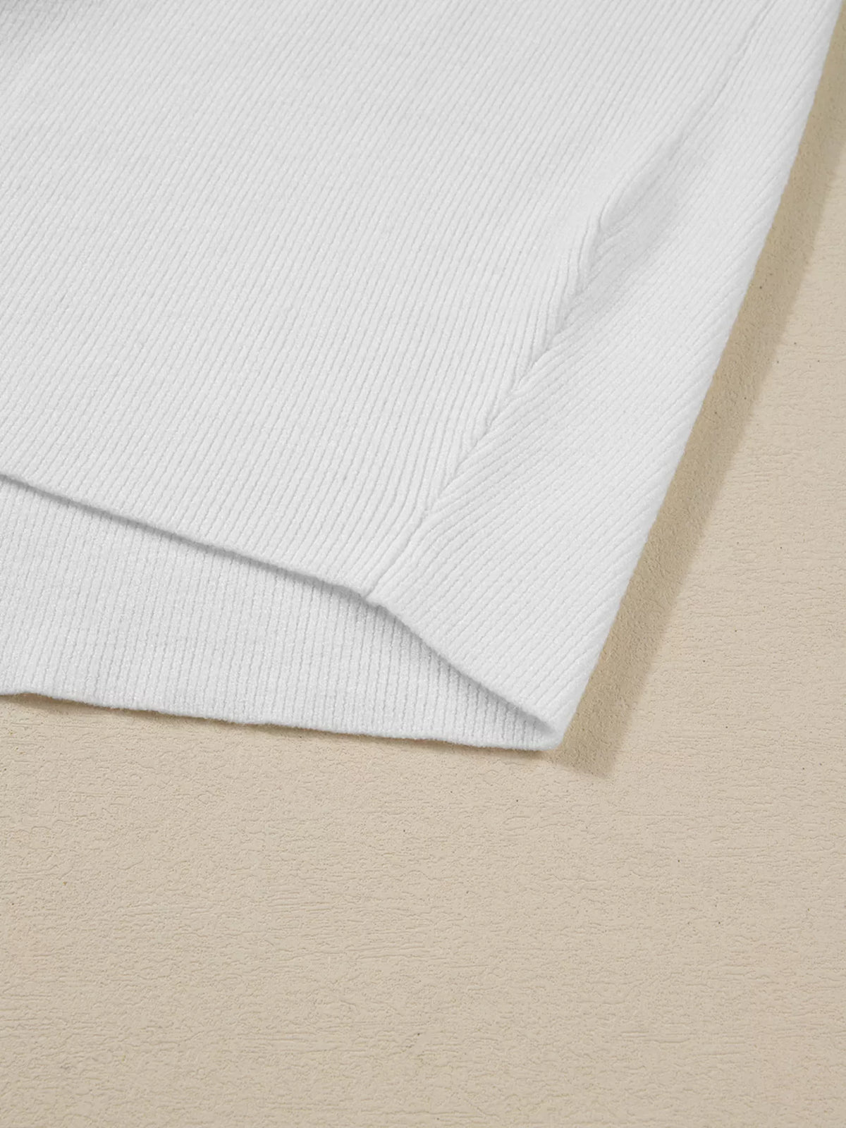 Close-up of ivory sweatshirt hem and seam