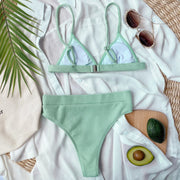 Mint green ribbed bikini set arranged flat, showing white cup lining