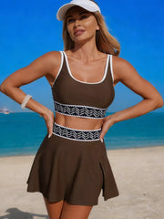 Brown tank and skort swim set with white edging and patterned trim