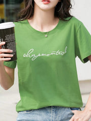 Model wearing a green crew-neck T-shirt with embroidered script lettering