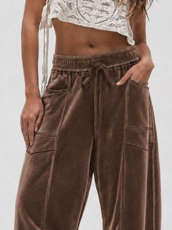 Brown velvet wide-leg pants with drawstring waist and side pockets, front view
