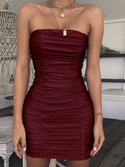 Front view of burgundy strapless ruched mini dress