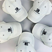 Light blue denim cap with curved brim and embroidered front logo