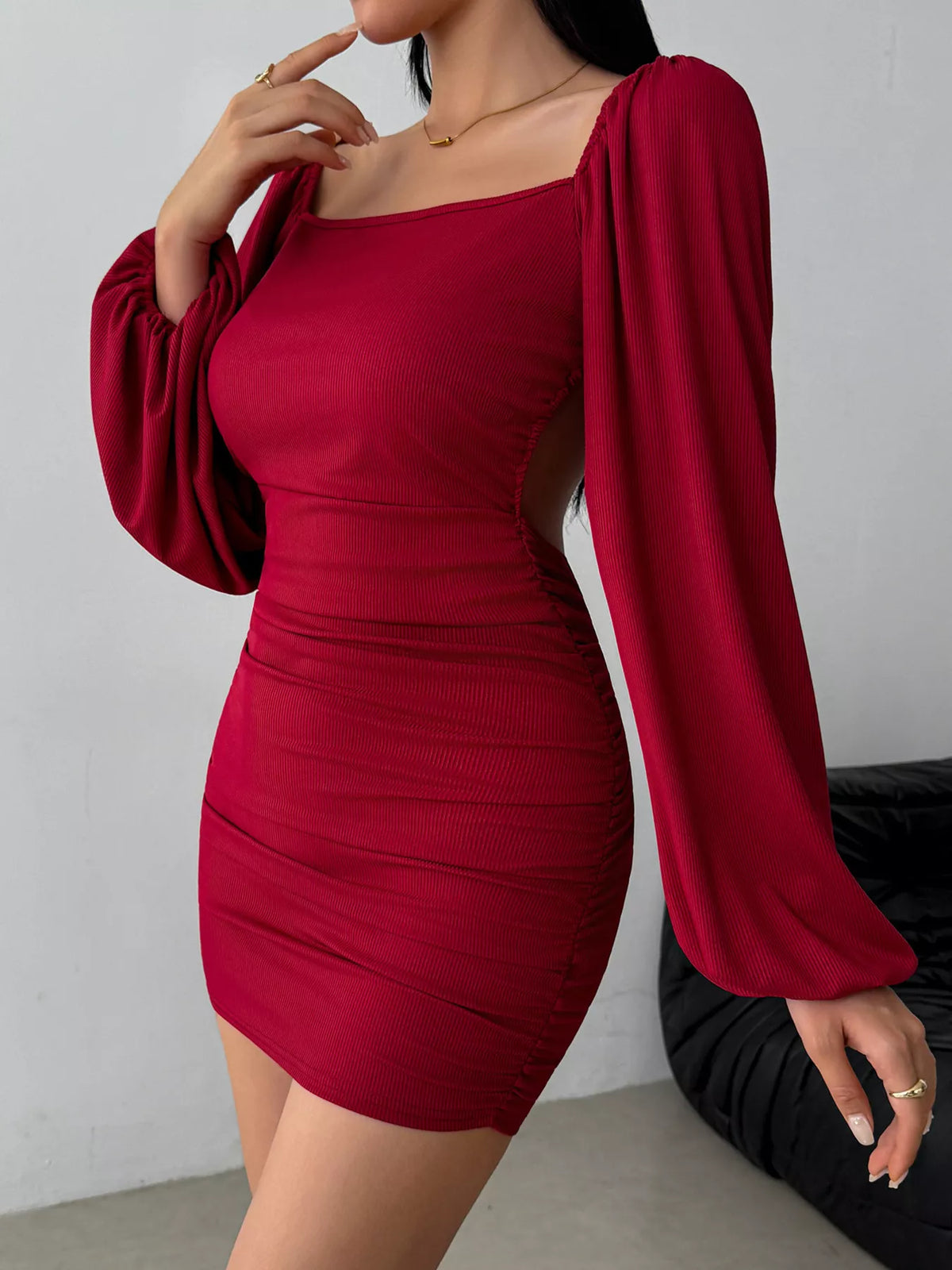 Three-quarter front view of burgundy square-neck dress with gathered waist