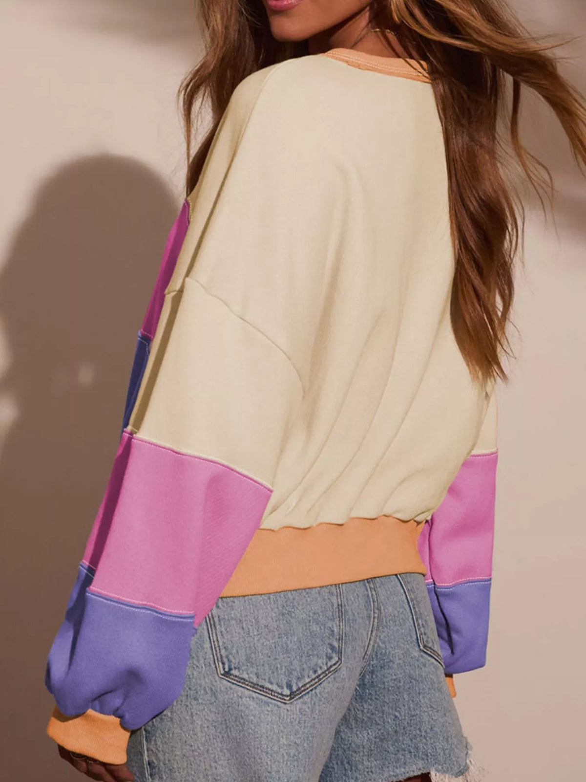 Back view of cropped off-shoulder color-block top