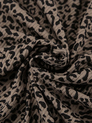 Close detail of leopard-print fabric and gathered seam