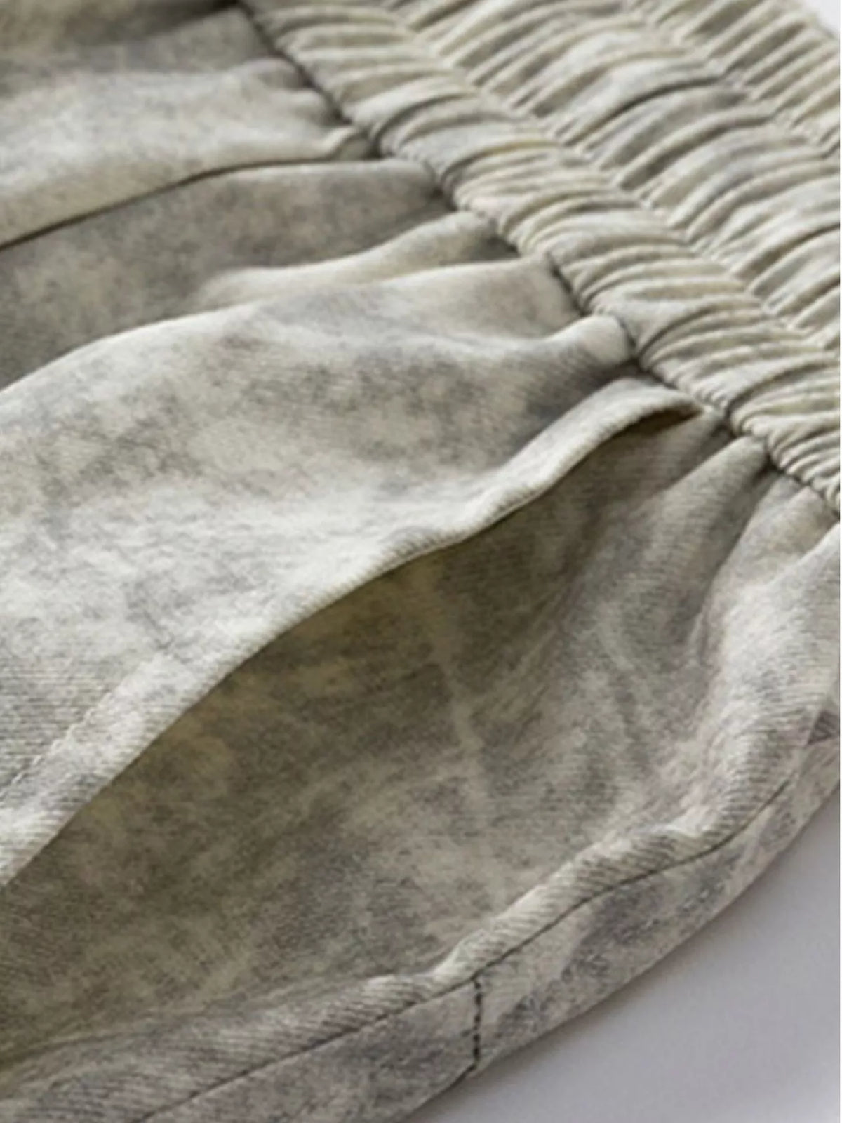 Close-up of gathered textured fabric on the shorts