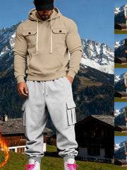 Front view of beige hoodie and grey cuffed cargo joggers in a mountain backdrop collage