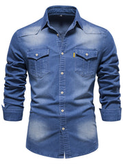 Cropped front view of blue denim shirt with two flap chest pockets