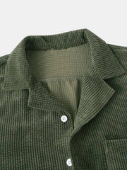 Close-up of olive textured collared shirt