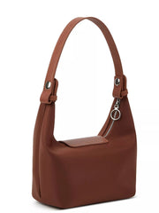 Angled back-side view showing the brown bag side seam and zippered top opening.