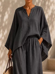 Closer view of the charcoal set showing its loose top and tied waist.