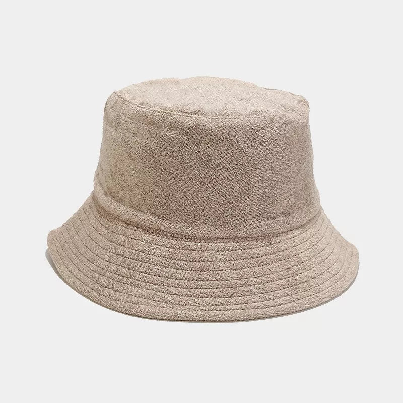 White wide-brim bucket hat shown from the front