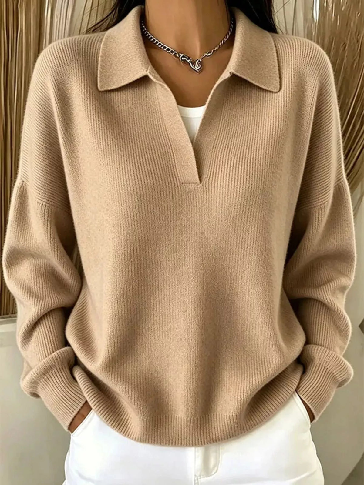 Light gray ribbed polo sweater shown close-up at chest and collar