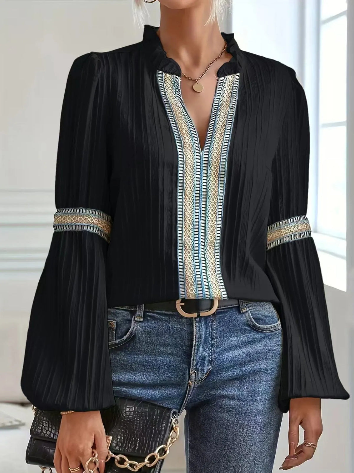 Notched textured balloon-sleeve blouse in black front view