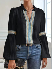 Notched textured balloon-sleeve blouse in black front view