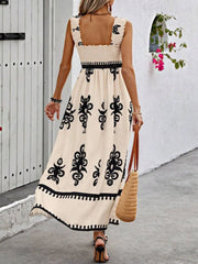 Back view of cream maxi dress with black floral print