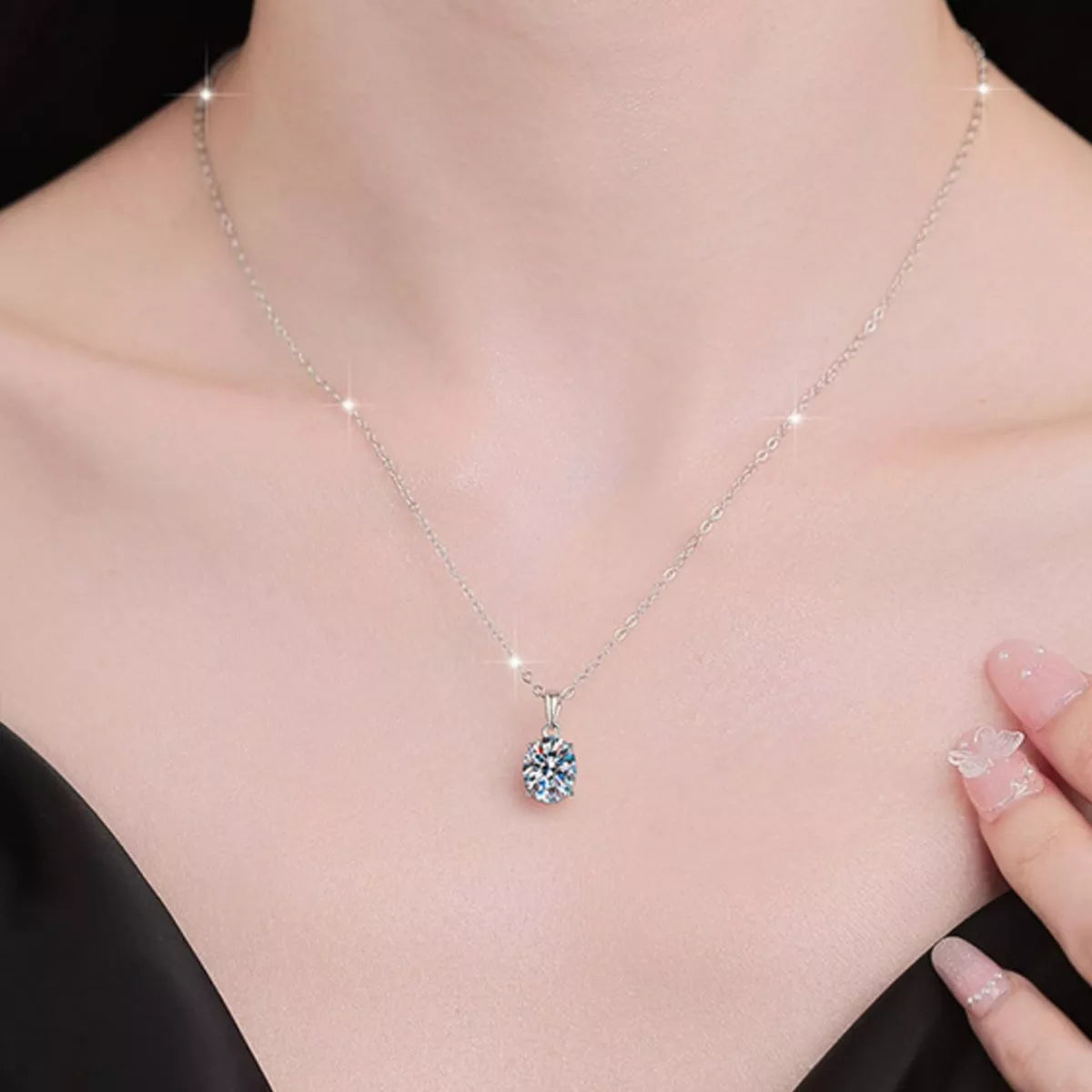 Moissanite pendant necklace worn at the neckline
