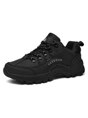 All-black lace-up shoe with reinforced toe and heel panels, angled product view