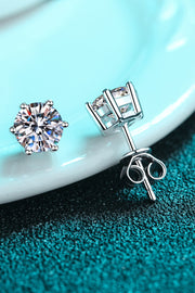 Close view of round moissanite stud earrings and posts