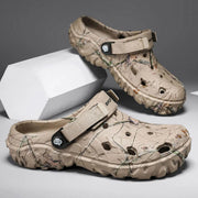 Pair of khaki printed clogs with ventilation holes and wide instep straps