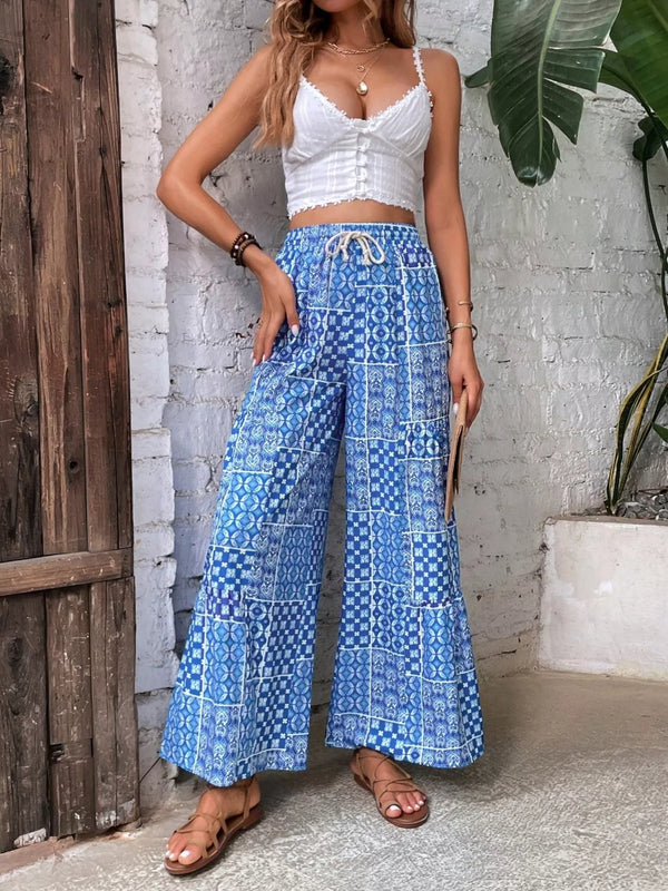 Blue patterned high-waisted wide-leg pants with a drawstring