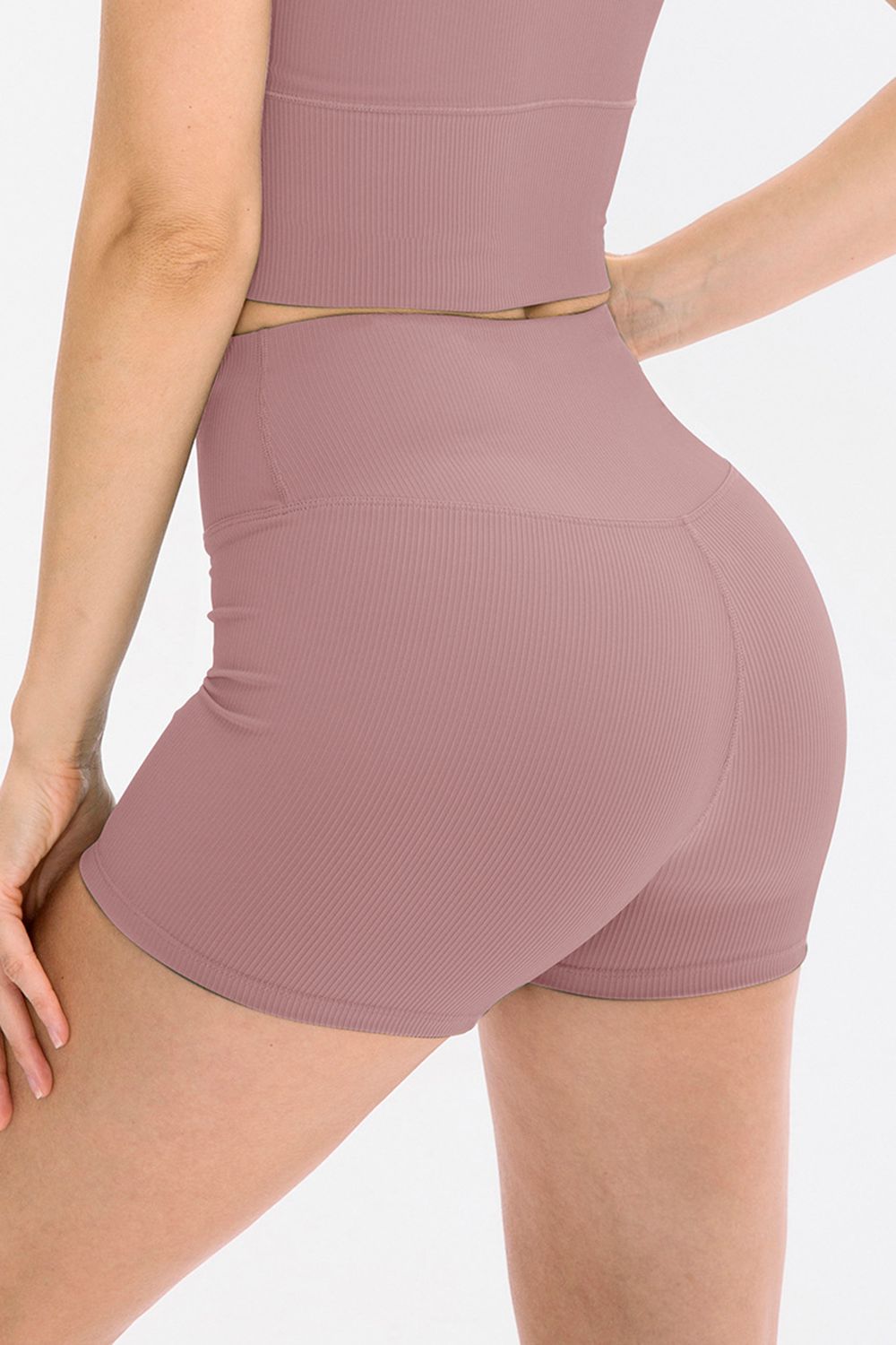 Rear view of olive-green ribbed biker shorts with wide waistband