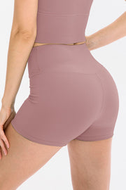 Rear view of olive-green ribbed biker shorts with wide waistband