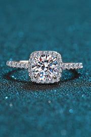 Front view of square halo ring with a pavé-set band on teal.