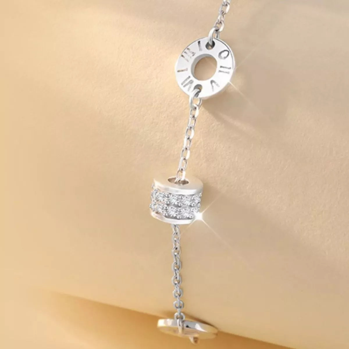 Close detail of the bracelet chain and geometric settings