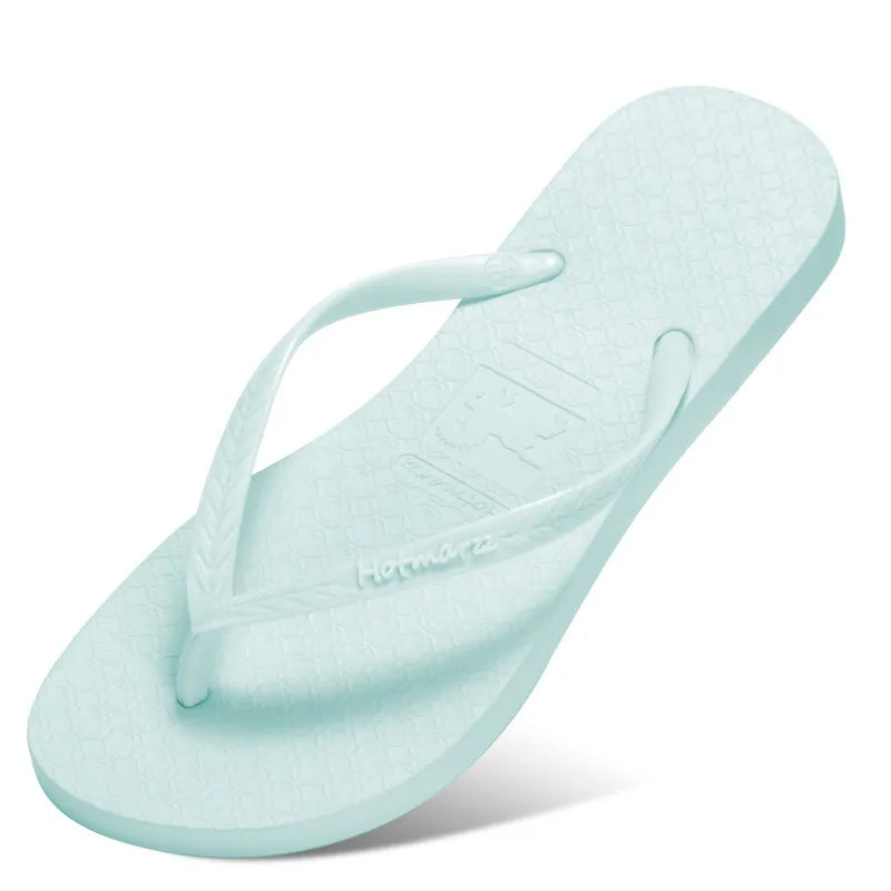 Pale mint toe-post flip-flop with matching straps, angled view