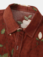 Close-up of floral shirt collar and leafy print