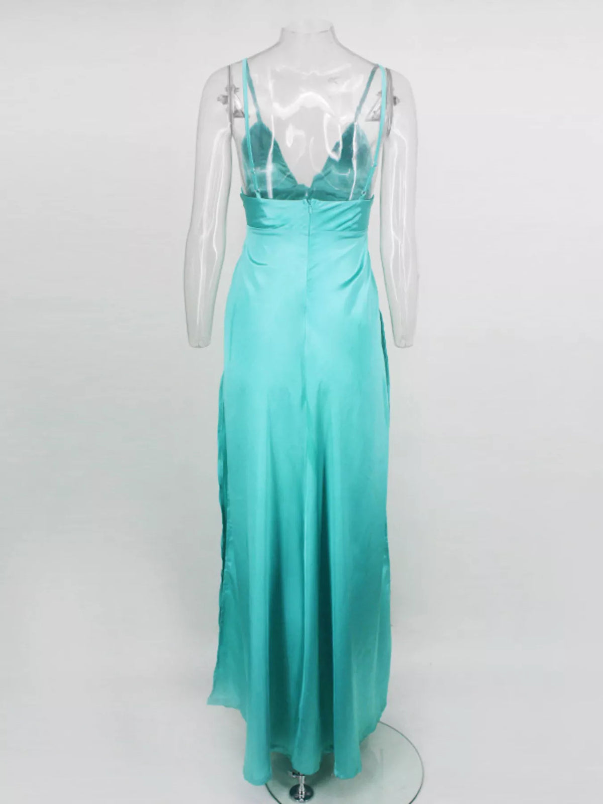 Back view of turquoise maxi dress showing its open-back strap design