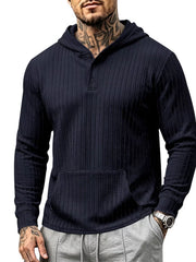 Model wearing navy textured hoodie with kangaroo pocket