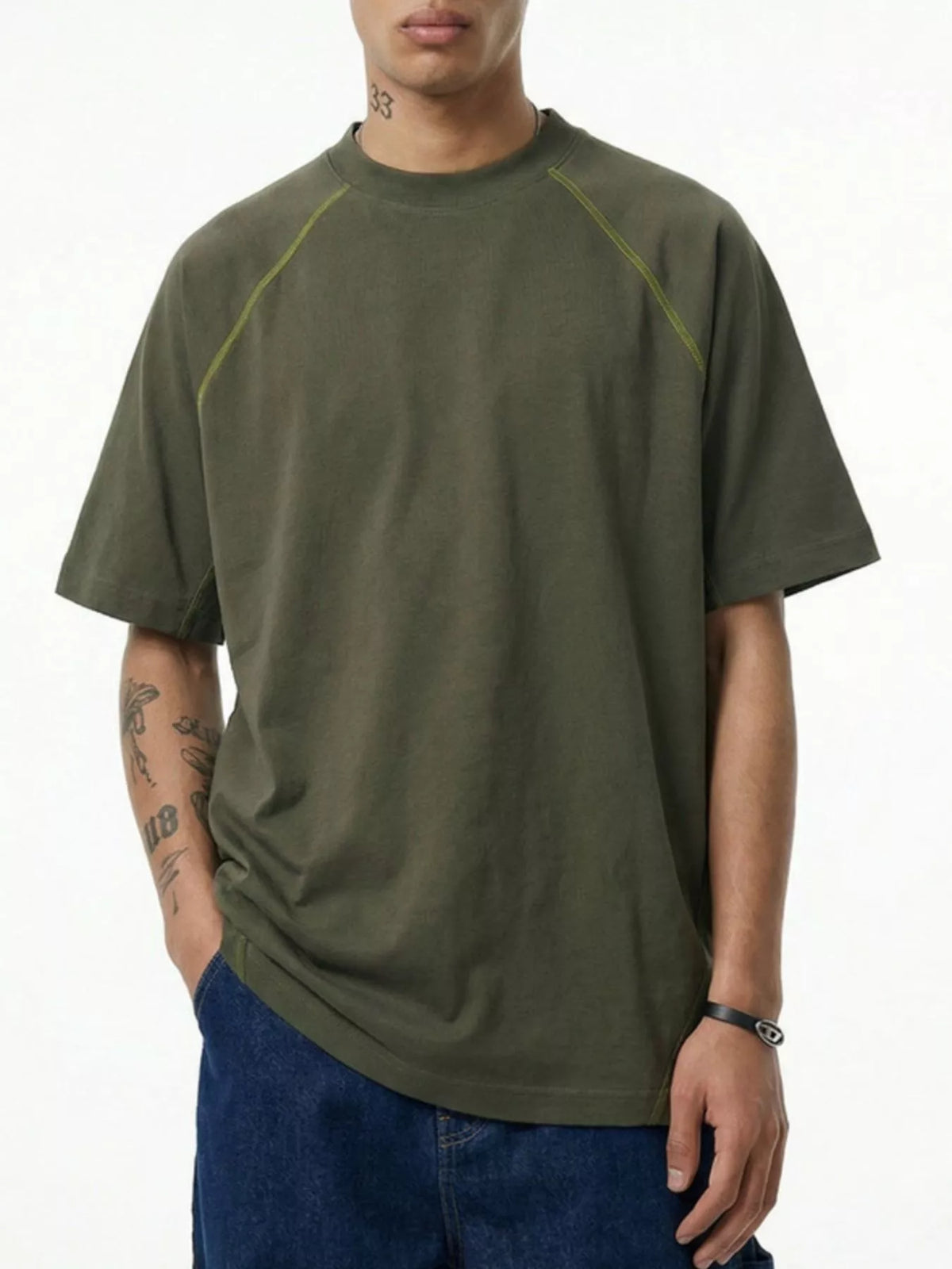 Model wearing olive green short-sleeve crew-neck T-shirt